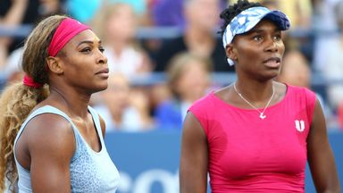 Serena Williams (L) and Venus Williams  against Timea Babos and Kristina Mladenovic at the 2014 US Open